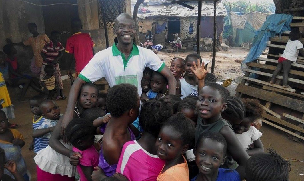 Our Co-Director Lamzo with some of the children he teaches, whose  parents can’t afford school fees. 